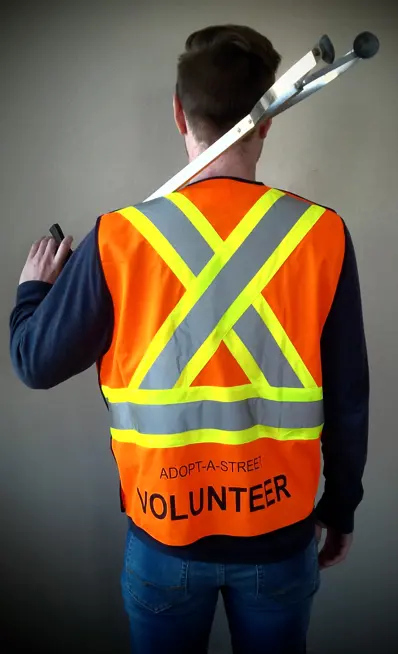 Back of orange vest: Adopt-a-Street volunteer.