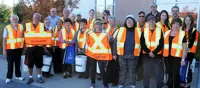 Large group of volunteers poses for picture.